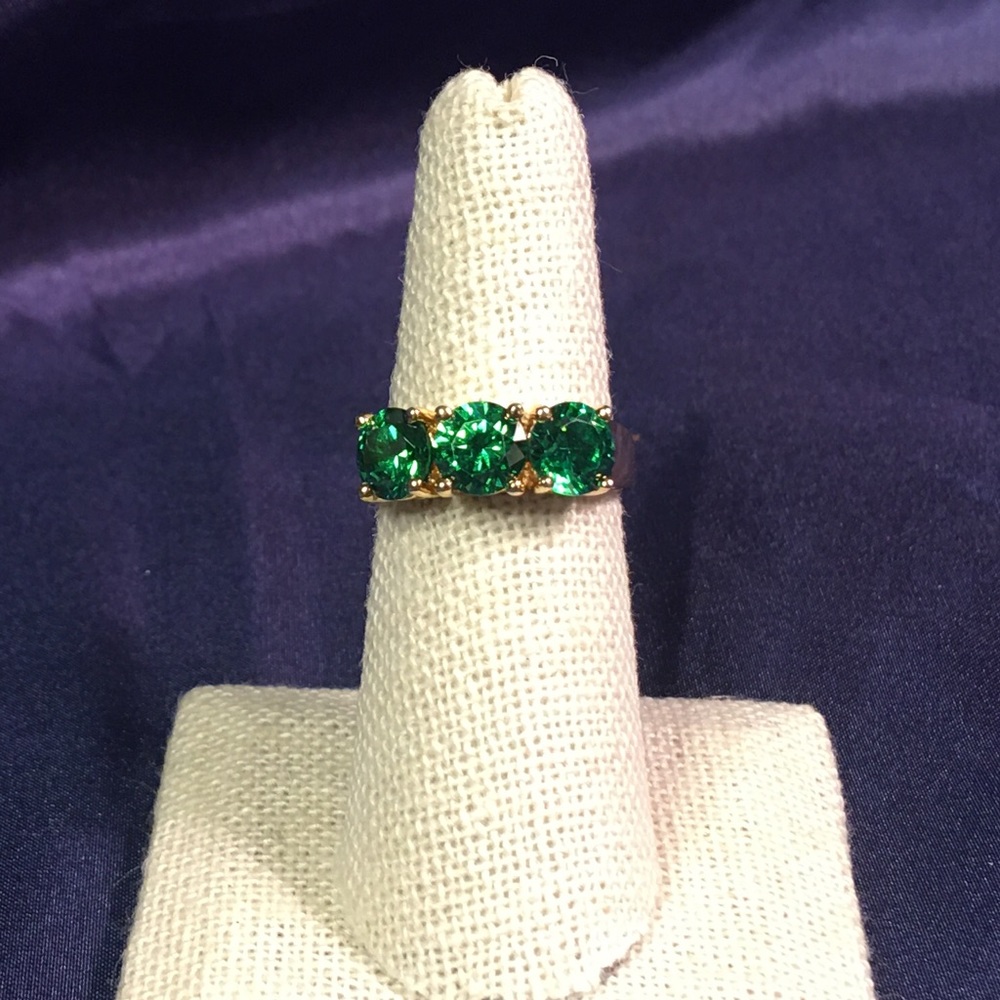 Emerald three stone and gold ring